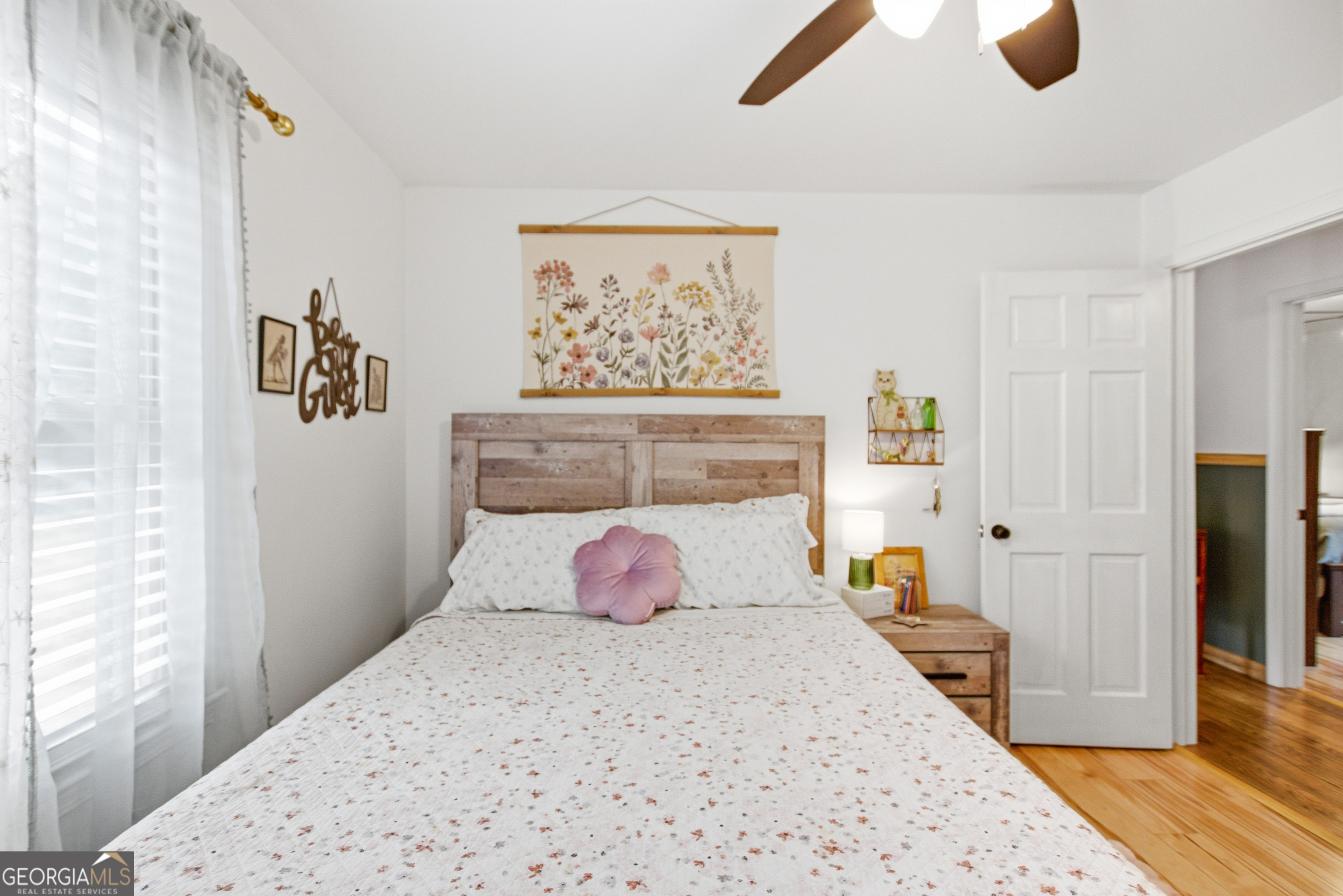 127 Akins Bridge Road Eastanollee, GA 30538 - Photo 40 of 52 a bedroom with a bed and wooden floor