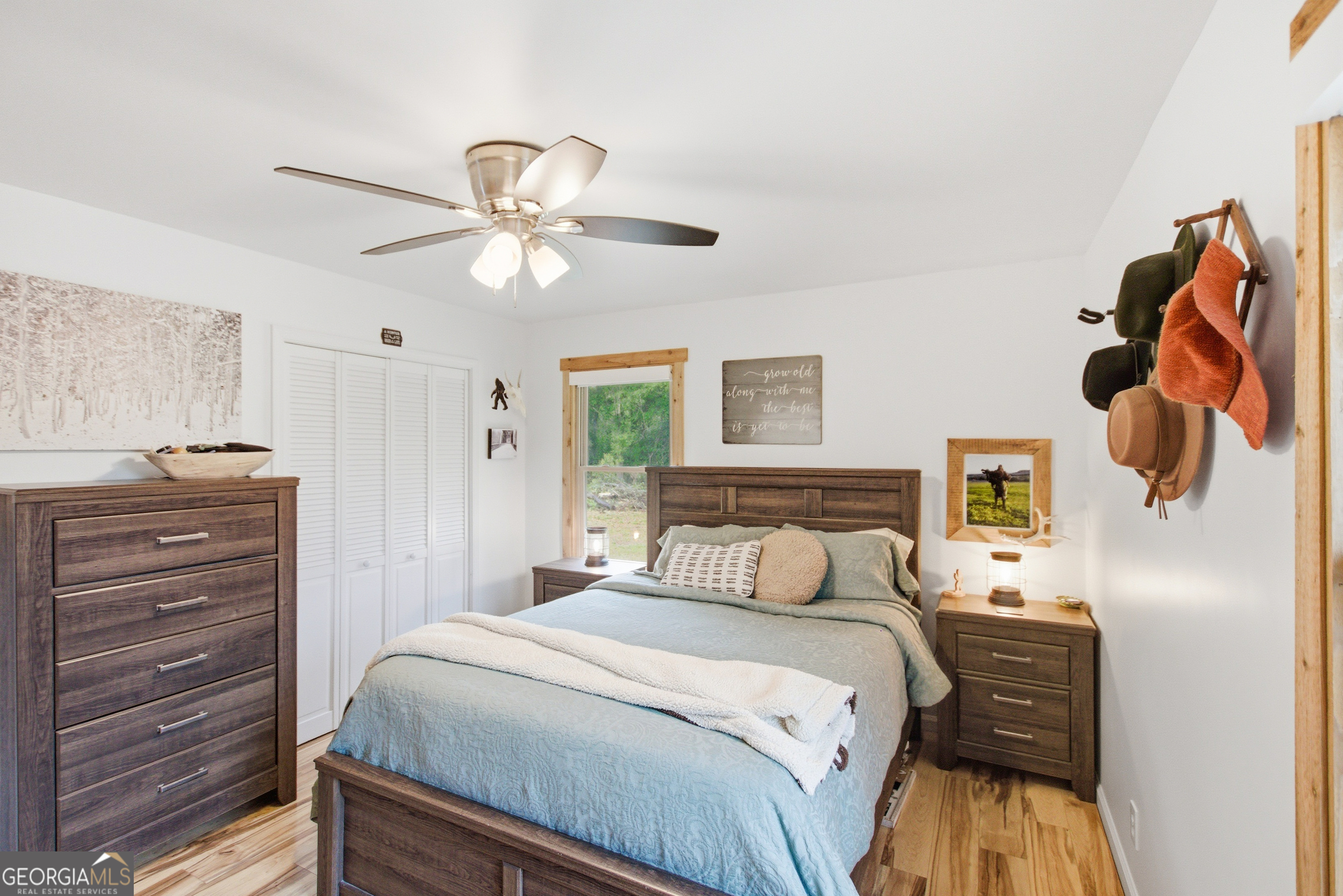 127 Akins Bridge Road Eastanollee, GA 30538 - Photo 46 of 52 a bedroom with a bed and a chandelier