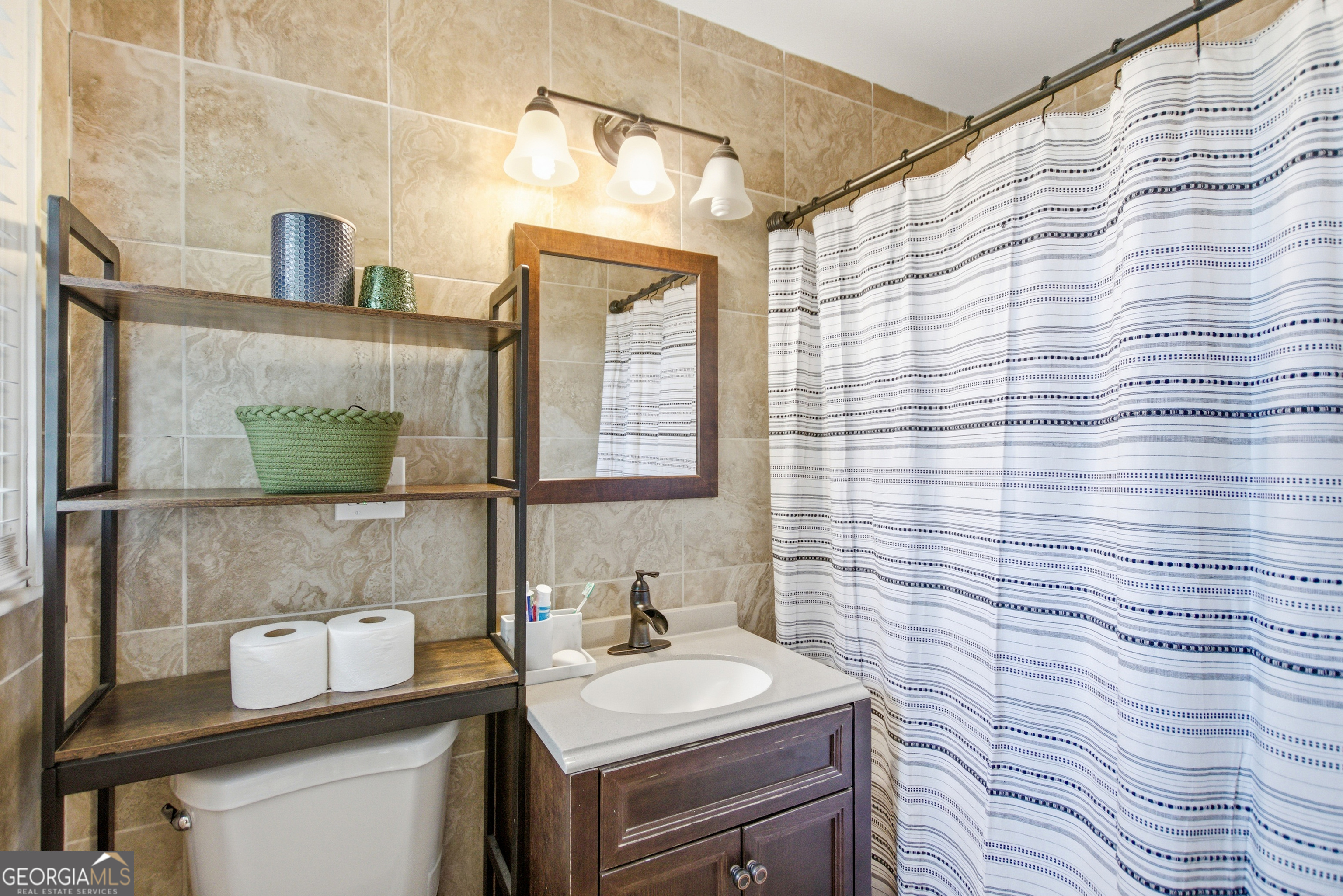 127 Akins Bridge Road Eastanollee, GA 30538 - Photo 48 of 52 a bathroom with a sink and a mirror
