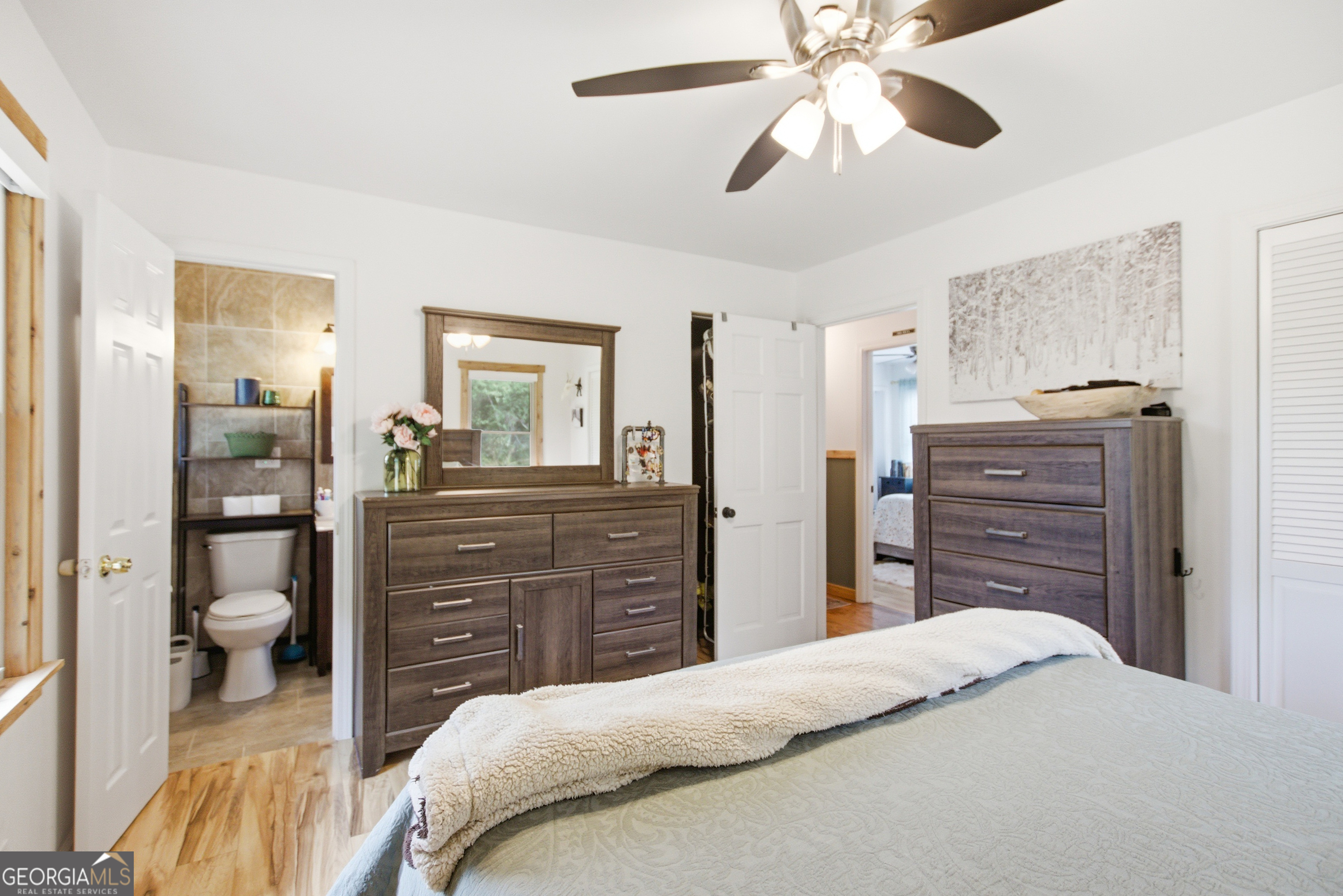 127 Akins Bridge Road Eastanollee, GA 30538 - Photo 49 of 52 a bedroom with a bed and a dresser