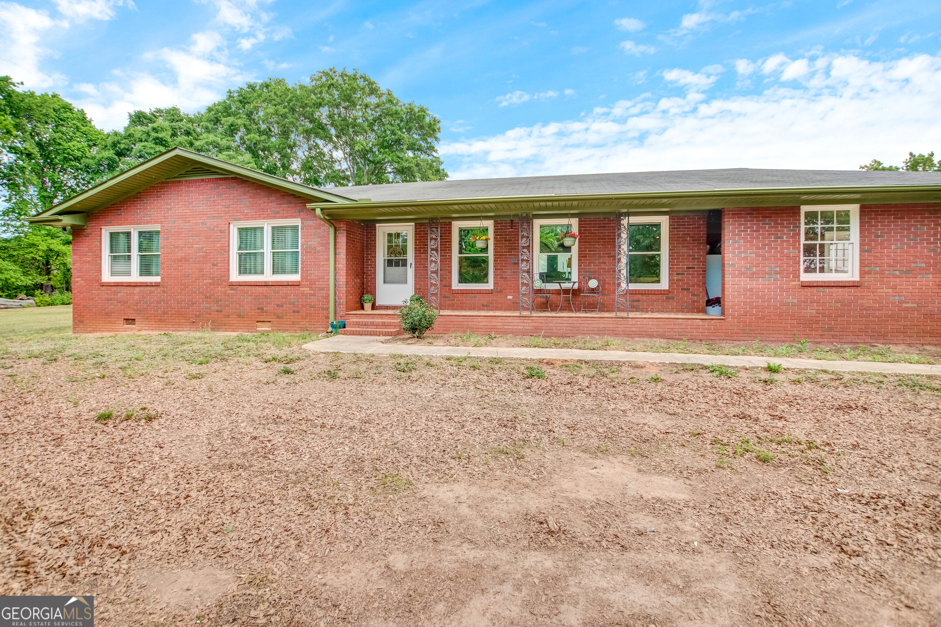 127 Akins Bridge Road Eastanollee, GA 30538 - Photo 10 of 52 a front view of house with yard and trees in the background