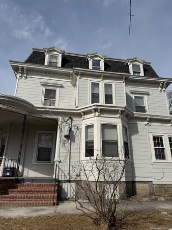 a view of a car park in front of house
