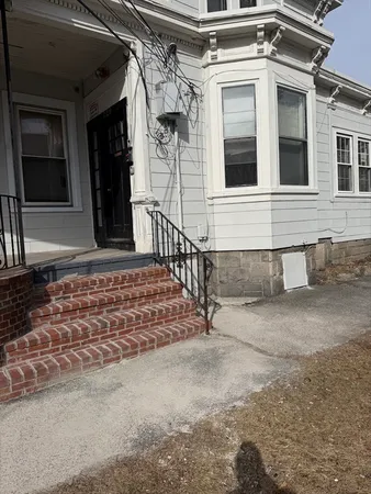 a kitchen with stainless steel appliances granite countertop a sink a stove and a white cabinet