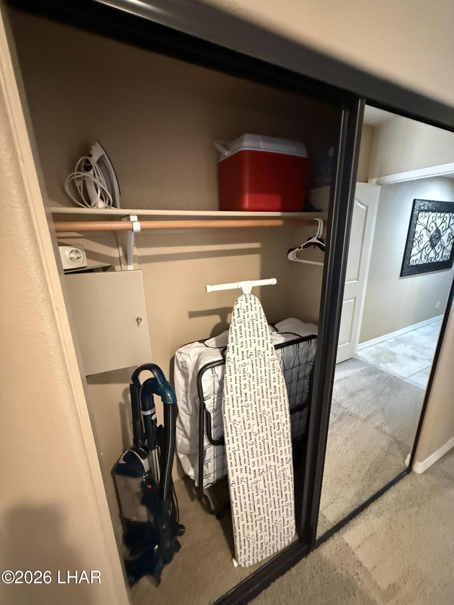 433 London Bridge Road, Unit B101 Lake Havasu City, AZ 86403 - Photo 24 of 35 a view of walk in closet with clothes and shoes