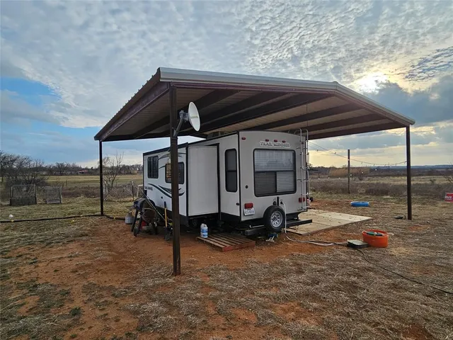a view of a backyard with swimming pool