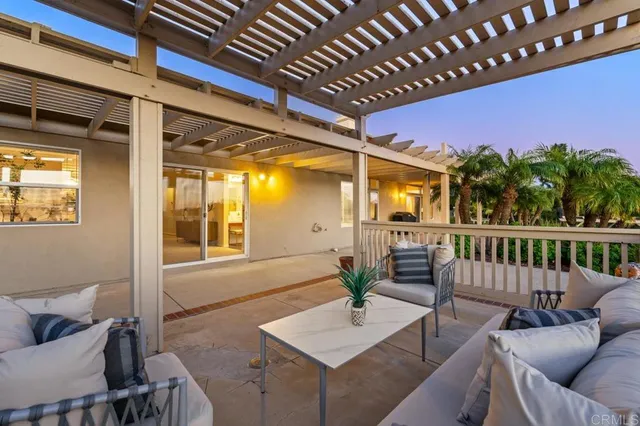 a very nice looking living room with a large window and wooden floor