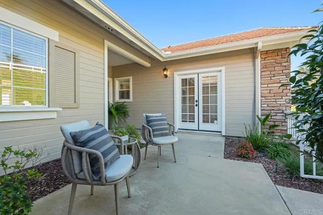 a kitchen with stainless steel appliances granite countertop wooden cabinets a sink and dishwasher with wooden floor