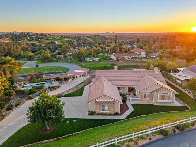 an aerial view of a house with a garden