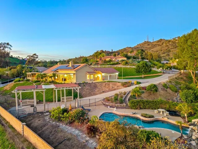 an aerial view of a house with a garden