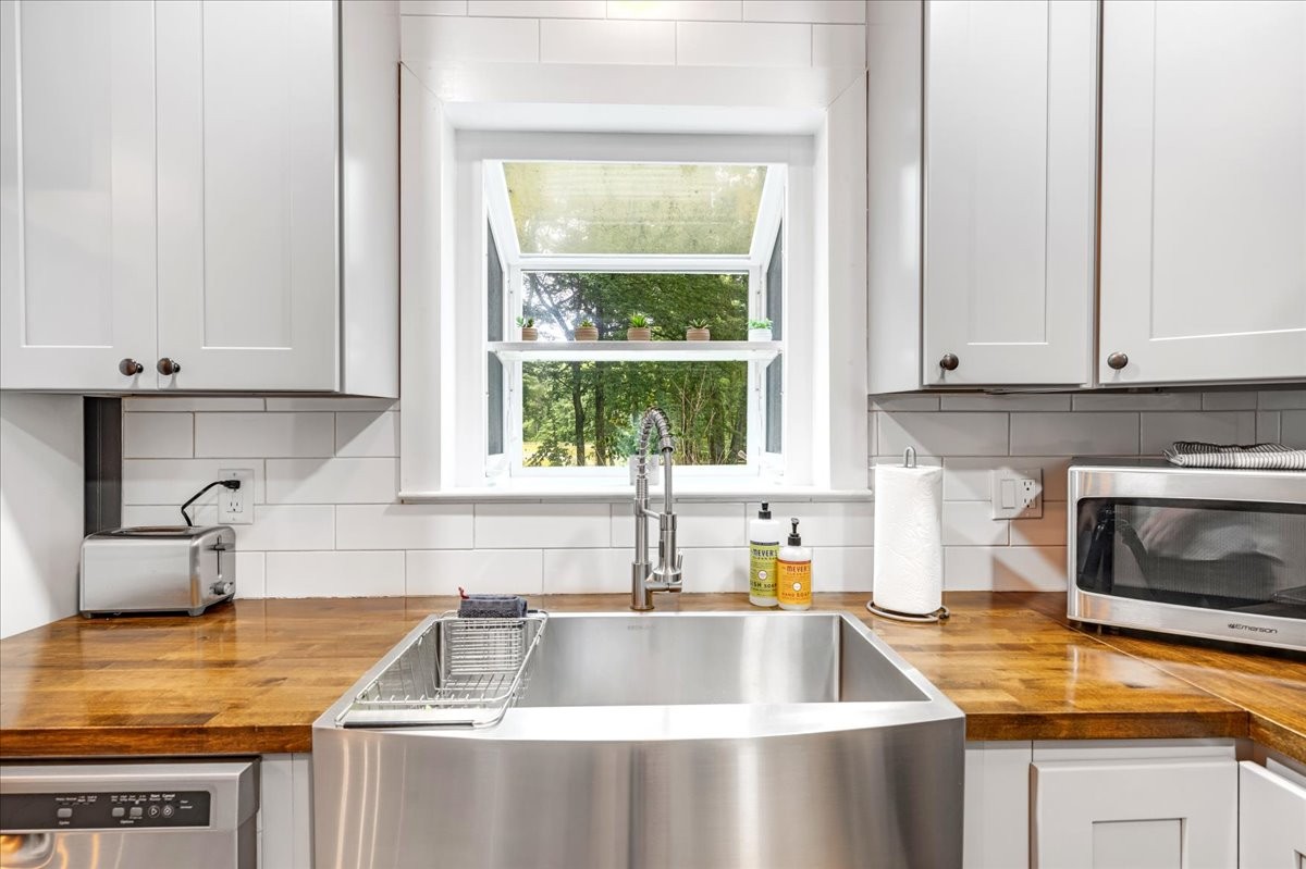 802 Evans Road Winchester, TN 37398 - Photo 12 of 43 a kitchen with granite countertop a sink and a window