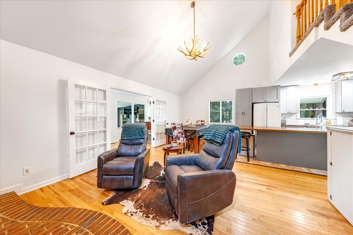 802 Evans Road Winchester, TN 37398 - Photo 17 of 43 a living room with furniture a chandelier and a dining table