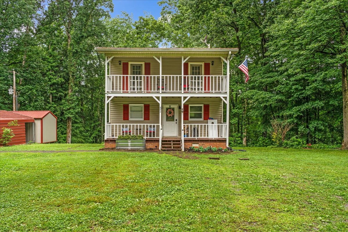 802 Evans Road Winchester, TN 37398 - Photo 40 of 43 a front view of a house with a garden