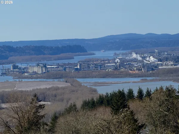 a view of ocean with a building in the background