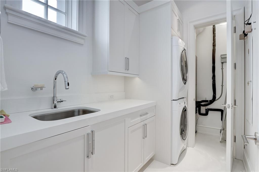 942 9th Avenue South Naples, FL 34102 - Photo 11 of 29 a bathroom with a sink and a mirror