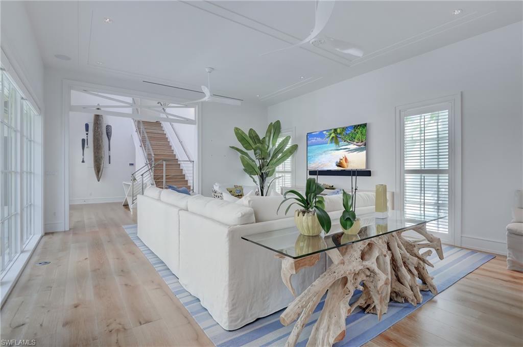 942 9th Avenue South Naples, FL 34102 - Photo 16 of 29 a living room with furniture and wooden floor