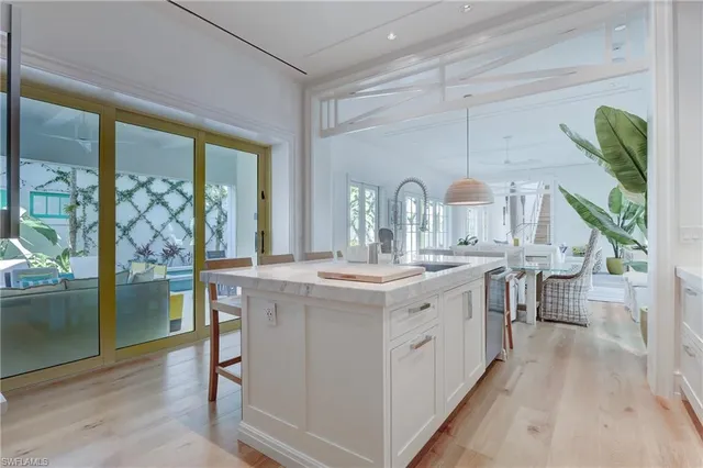 a bathroom with a double vanity sink and a large mirror