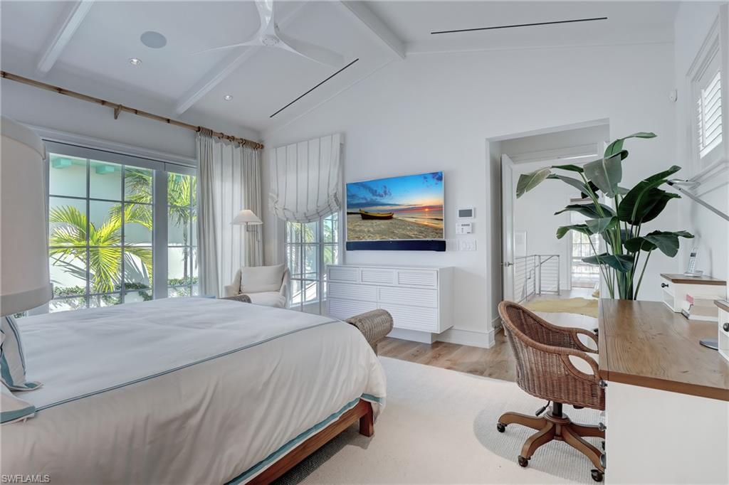942 9th Avenue South Naples, FL 34102 - Photo 26 of 29 a bedroom with a bed a large window and furniture