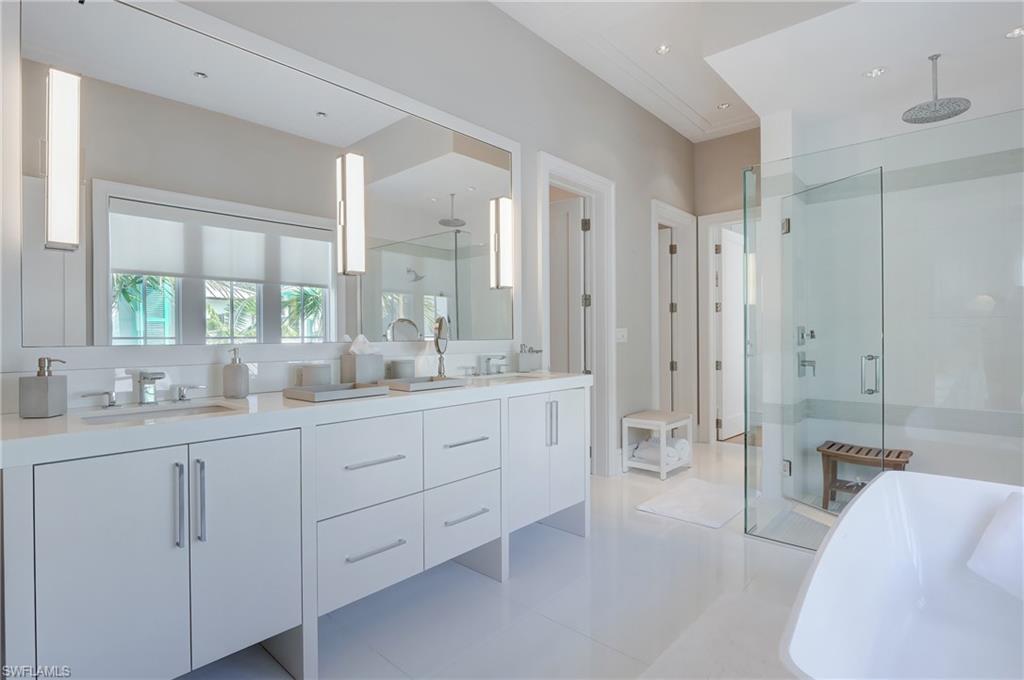 942 9th Avenue South Naples, FL 34102 - Photo 28 of 29 a spacious bathroom with double sink and a large mirror