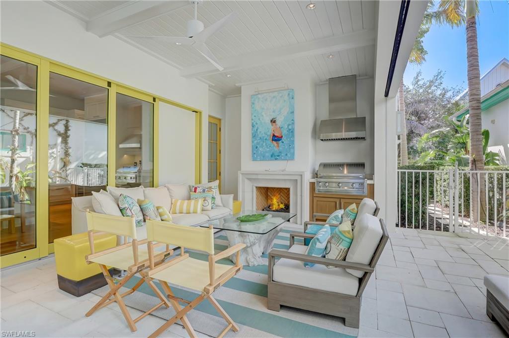 942 9th Avenue South Naples, FL 34102 - Photo 6 of 29 a living room with furniture and a fireplace