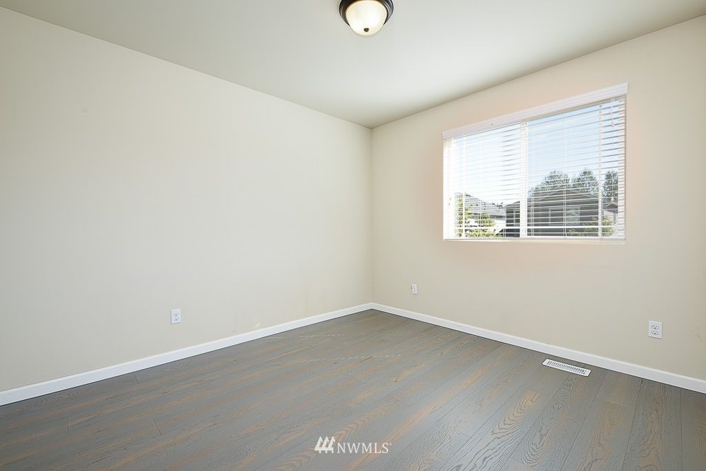 357 Field Place Northeast Renton, WA 98059 - Photo 16 of 26 an empty room with a window