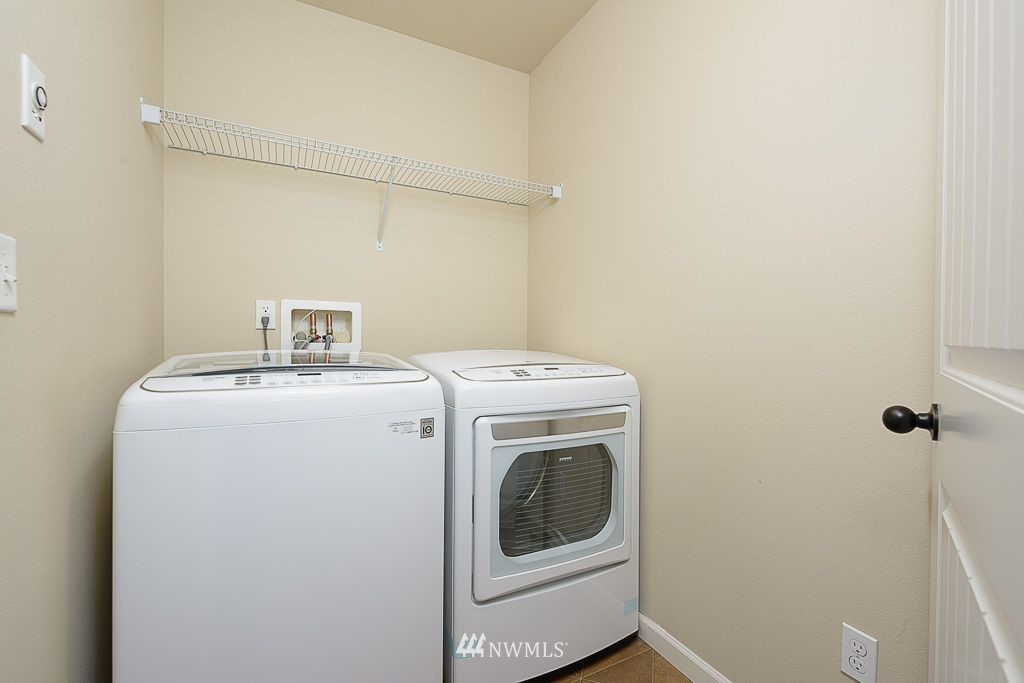 357 Field Place Northeast Renton, WA 98059 - Photo 19 of 26 a utility room with dryer and washer