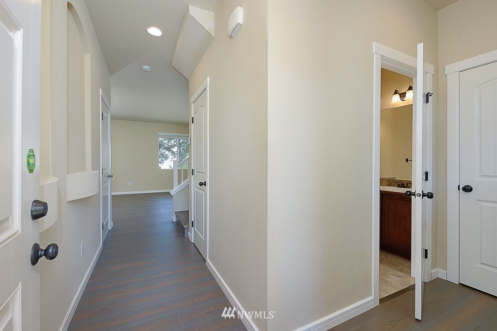 357 Field Place Northeast Renton, WA 98059 - Photo 3 of 26 a view of a hallway with a livingroom and closet