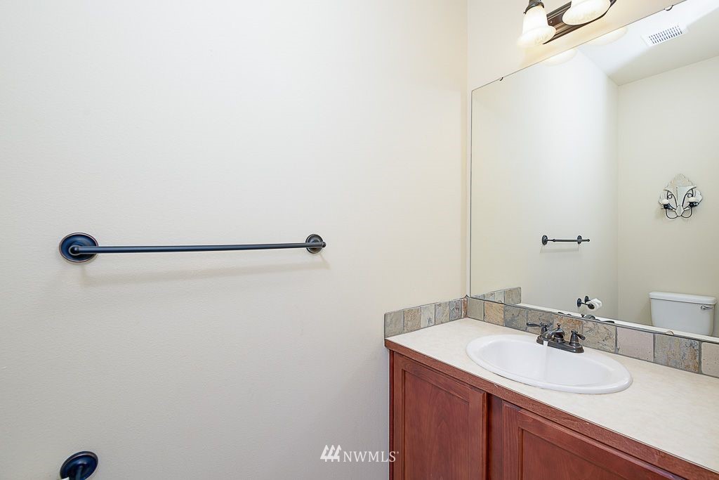 357 Field Place Northeast Renton, WA 98059 - Photo 10 of 26 a bathroom with a sink and a mirror