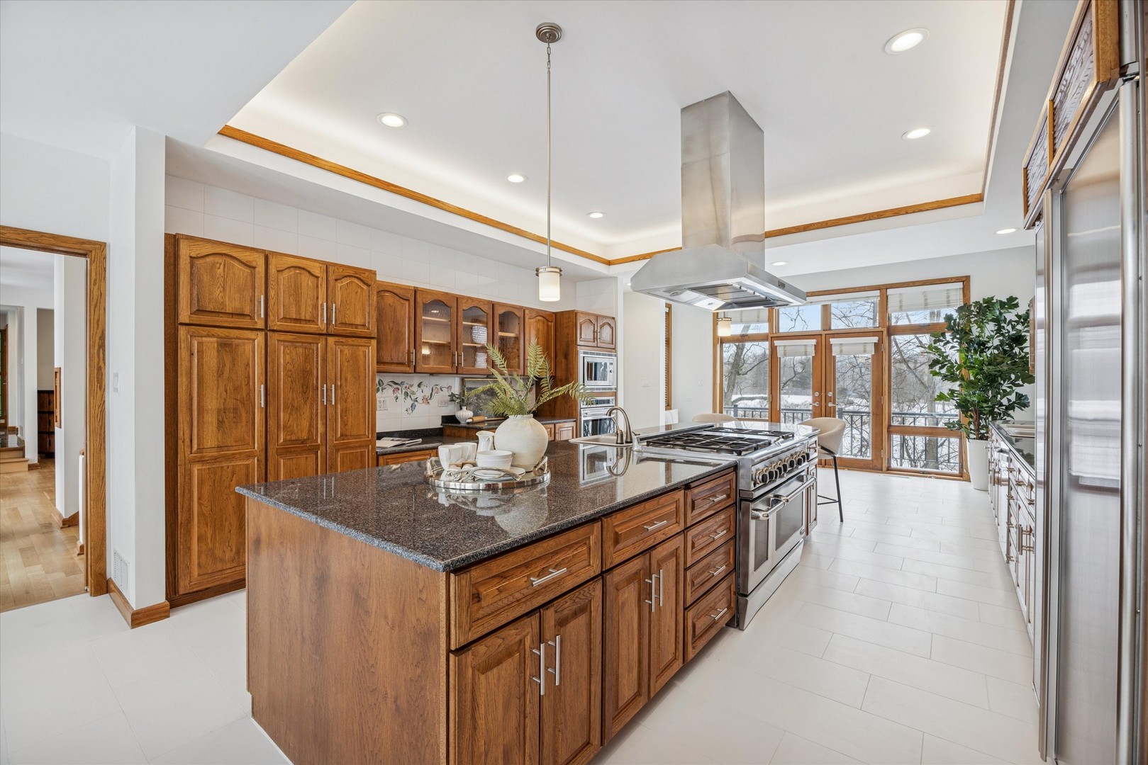 8425 Hickory Court Burr Ridge, IL 60527 - Photo 11 of 53 a kitchen with stainless steel appliances granite countertop a sink and a refrigerator