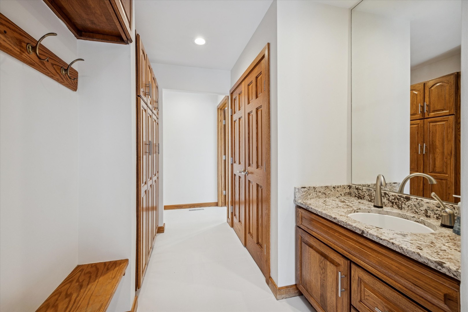 8425 Hickory Court Burr Ridge, IL 60527 - Photo 17 of 53 a bathroom with a granite countertop sink and a mirror