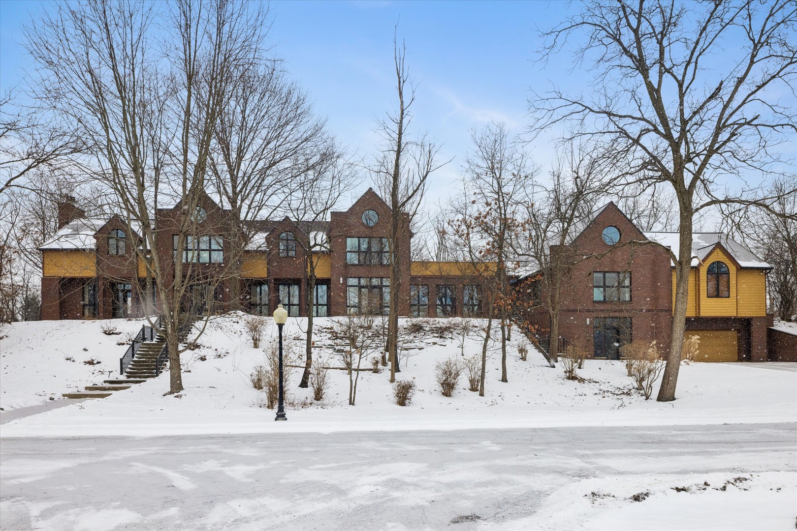 8425 Hickory Court Burr Ridge, IL 60527 - Photo 2 of 53 a view of a house with a snow in the yard