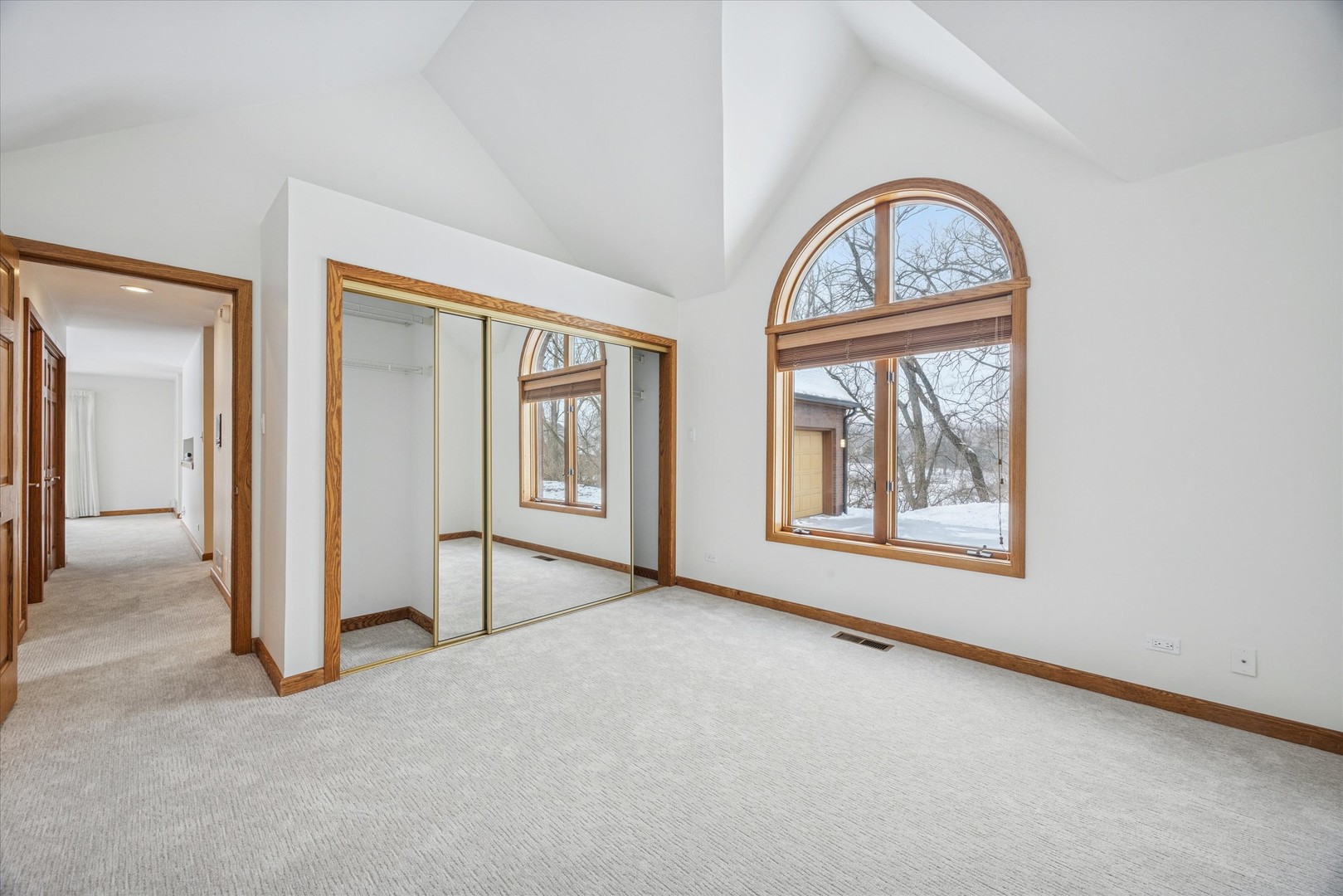 8425 Hickory Court Burr Ridge, IL 60527 - Photo 23 of 53 an empty room with windows mirror and windows