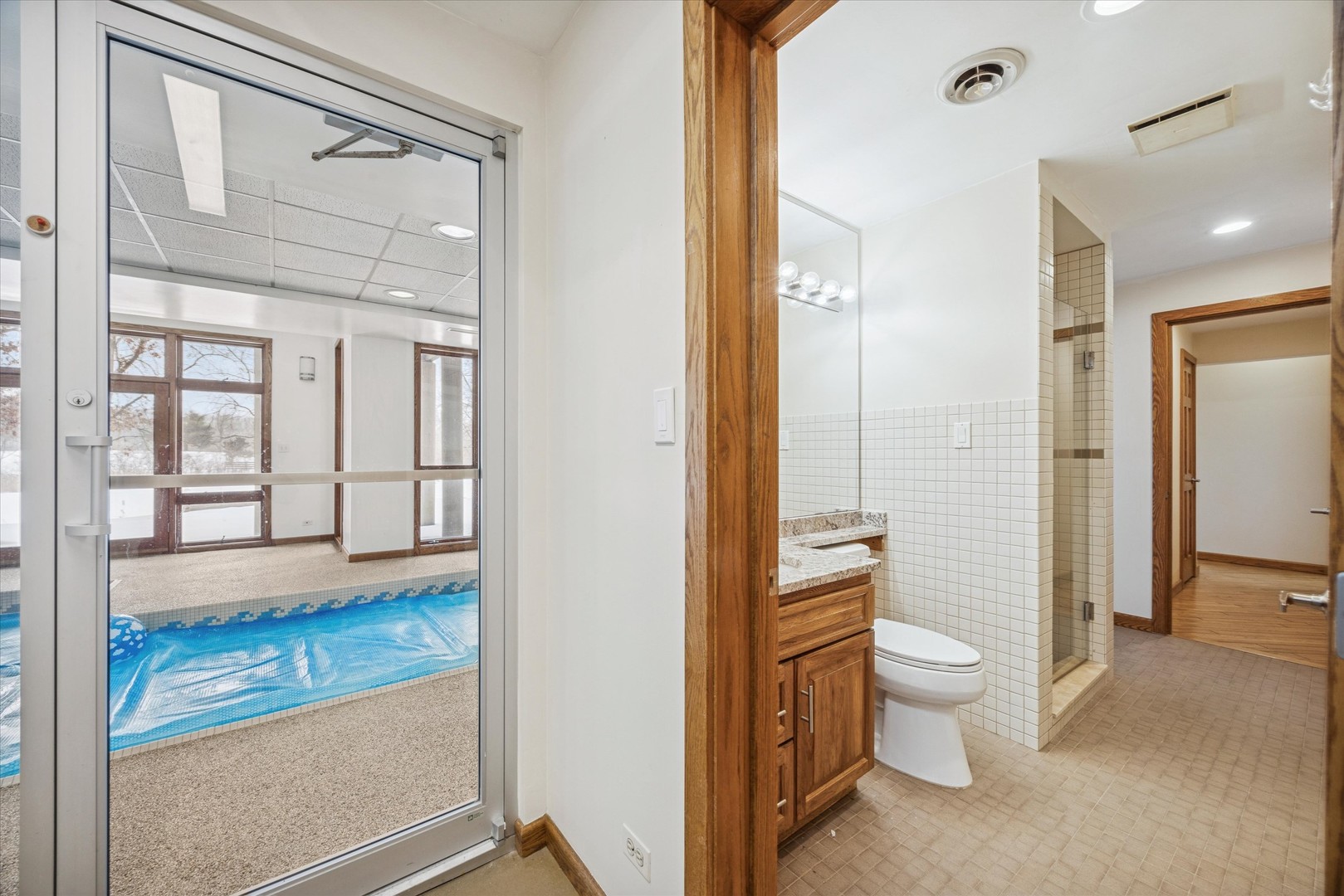 8425 Hickory Court Burr Ridge, IL 60527 - Photo 40 of 53 a bathroom with a granite countertop sink mirror vanity and toilet
