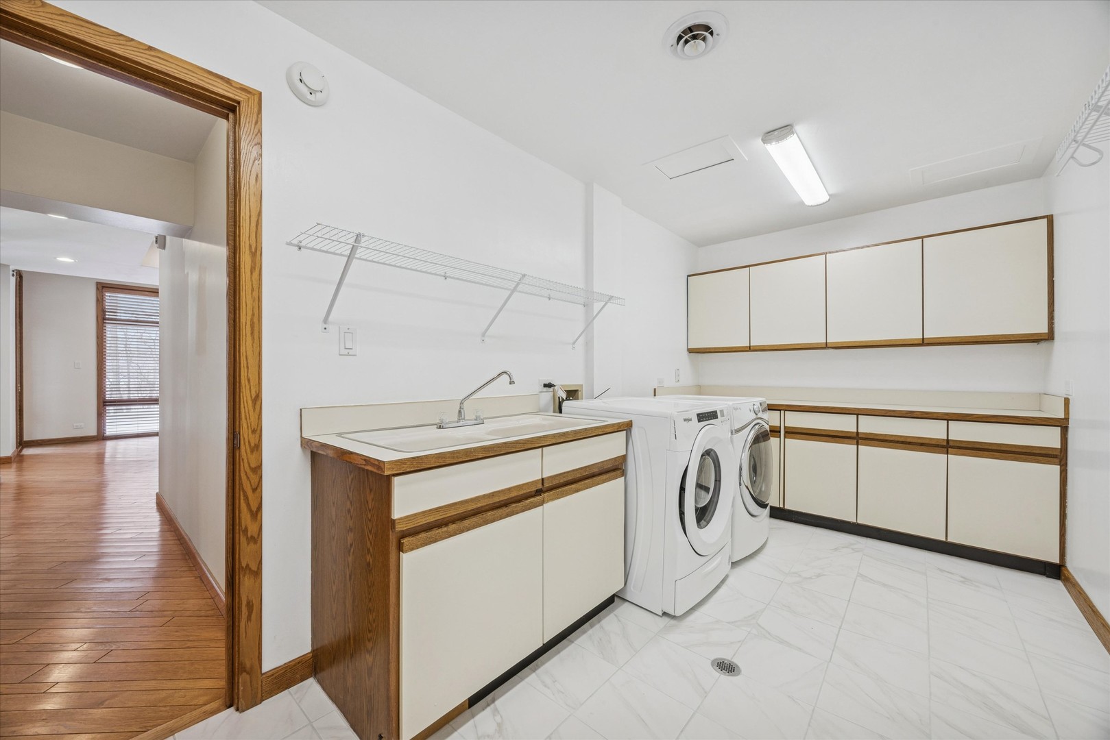 8425 Hickory Court Burr Ridge, IL 60527 - Photo 43 of 53 a view of washer and dryer with kitchen countertops
