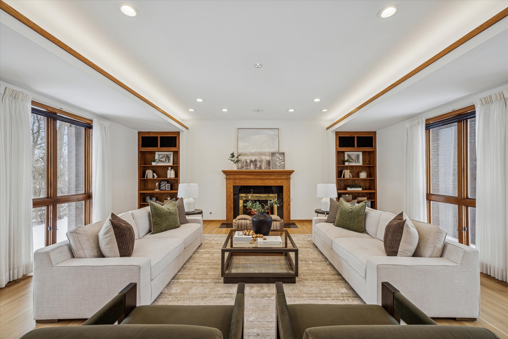 8425 Hickory Court Burr Ridge, IL 60527 - Photo 5 of 53 a living room with furniture and a fireplace