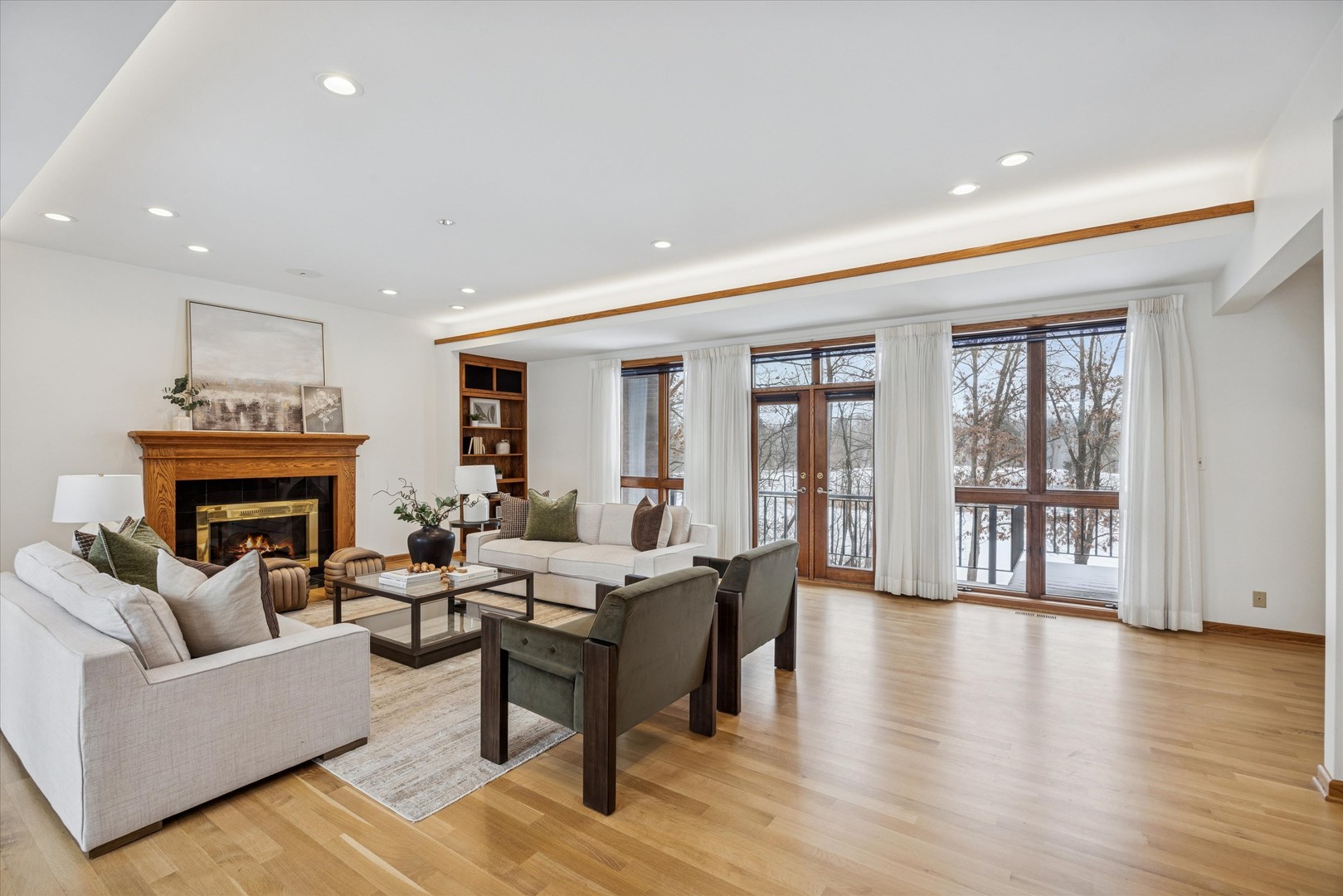 8425 Hickory Court Burr Ridge, IL 60527 - Photo 6 of 53 a living room with furniture and a fireplace