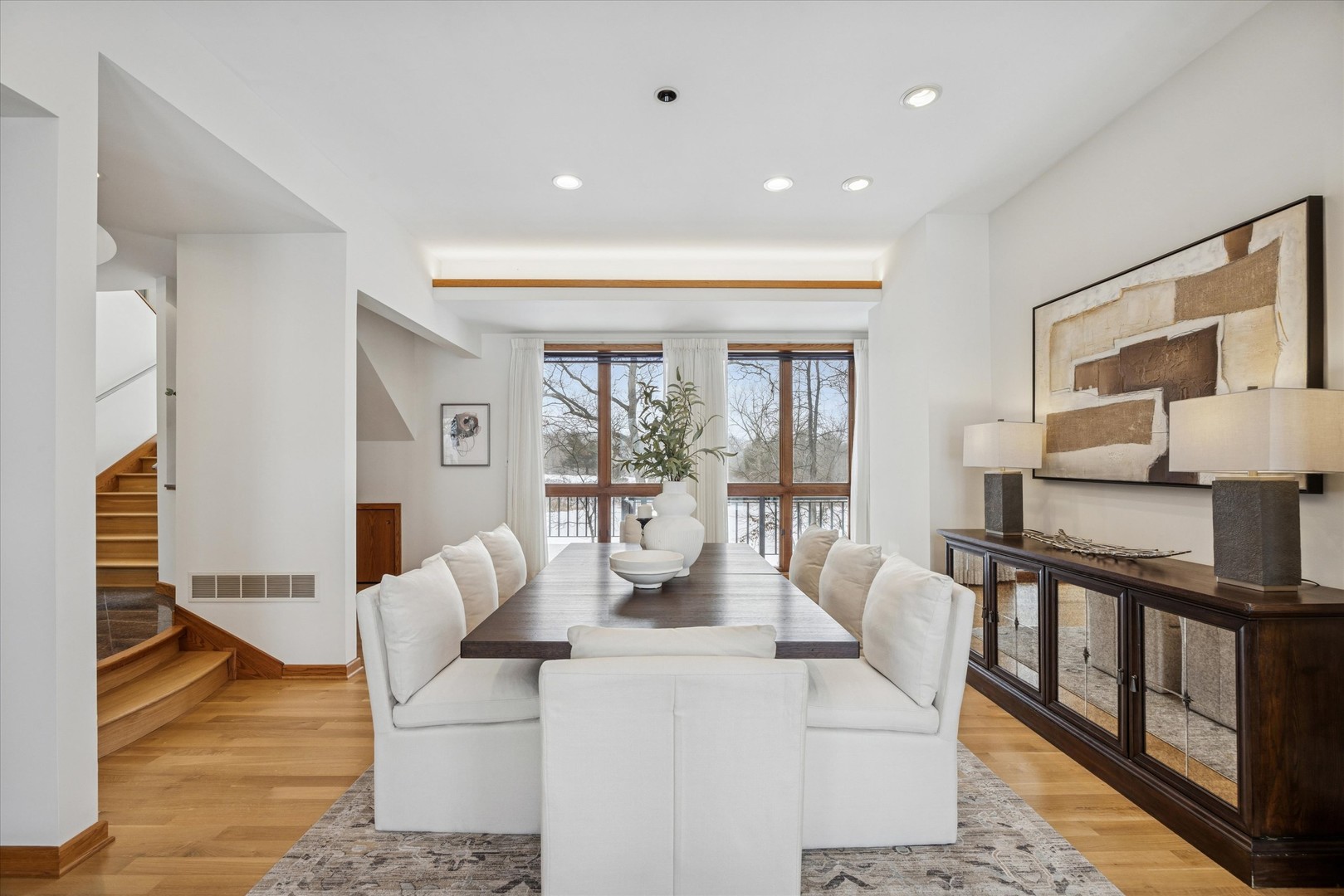 8425 Hickory Court Burr Ridge, IL 60527 - Photo 8 of 53 a living room with furniture a flat screen tv and a floor to ceiling window