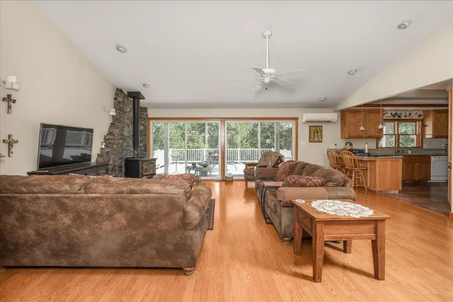 a living room with fireplace furniture and a flat screen tv