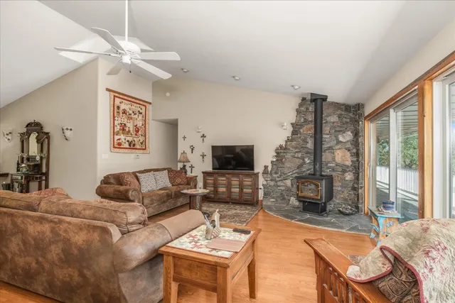 a large kitchen with stainless steel appliances granite countertop a refrigerator and a stove