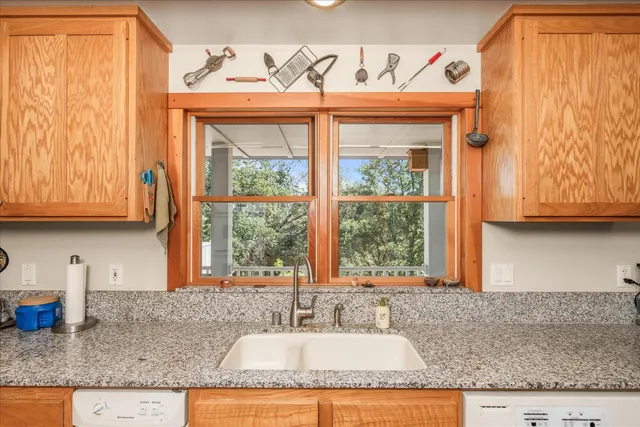 a bedroom with a large bed and a wooden floor