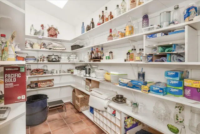 a spacious bathroom with a sink a mirror a bathtub and next to a window