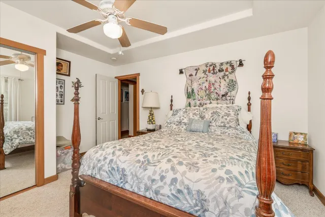 a patio with table and chairs and potted plants