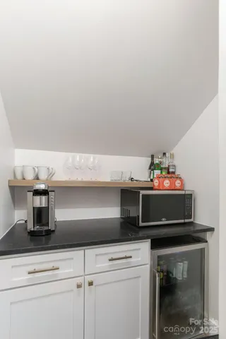 a kitchen with a microwave and cabinets