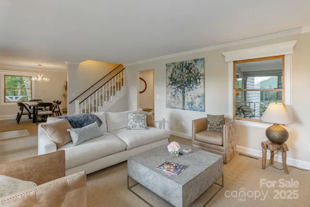 a living room with furniture and a rug