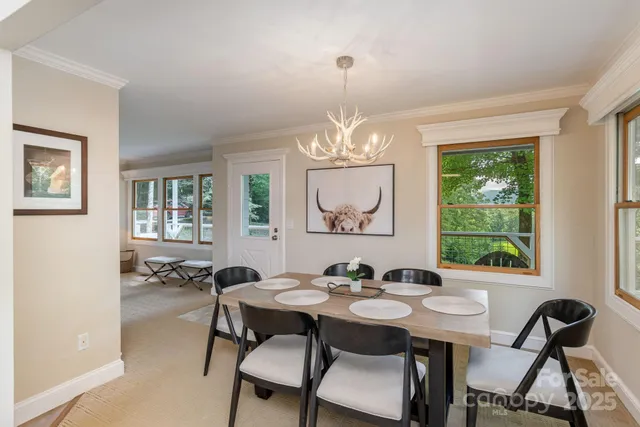 a view of a dining room with furniture window and outside view