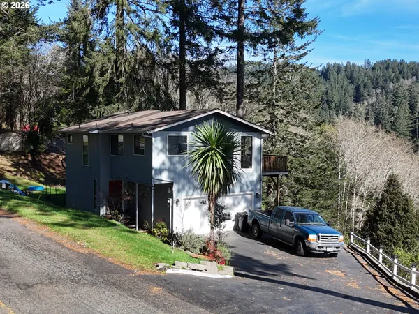 a view of a car park in front of house