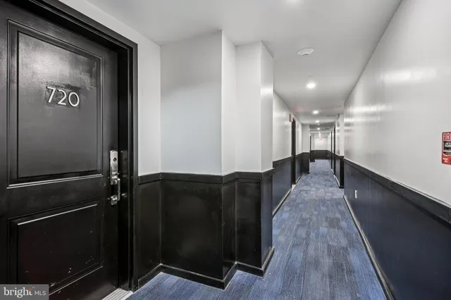 a view of gallery with wooden floor