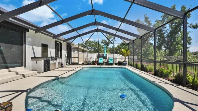 a view of swimming pool with a patio