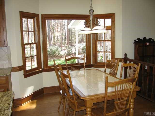 10604 Dunhill Terrace Raleigh, NC 27615 - Photo 6 of 12 Bay Window and Hardwood Floors in Breakfast Nook Breakfast Area