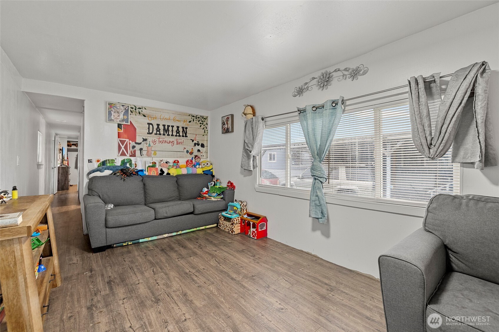 20420 Lafayette Road, Unit 11 Burlington, WA 98233 - Photo 4 of 14 a living room with furniture and a flat screen tv