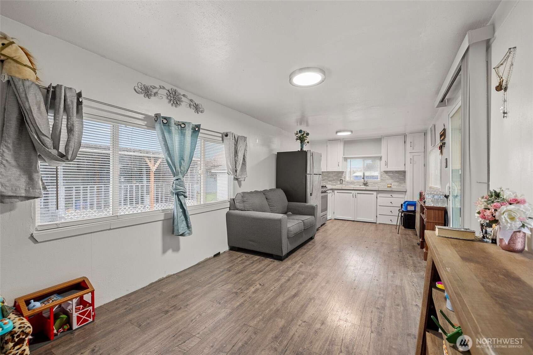 20420 Lafayette Road, Unit 11 Burlington, WA 98233 - Photo 5 of 14 a living room with furniture and a flat screen tv